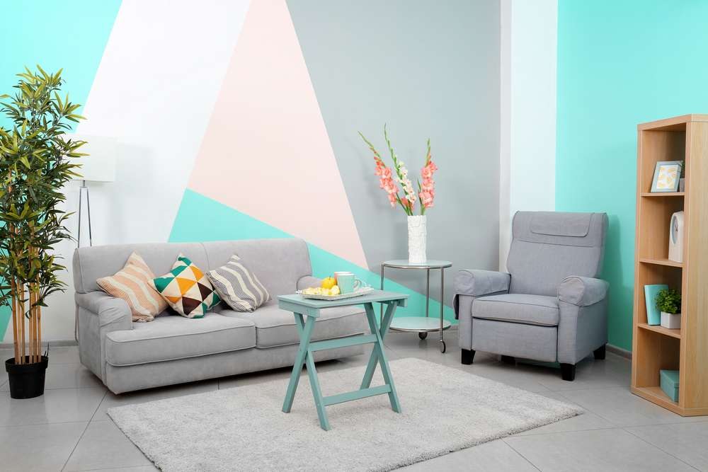 Living room with freshly painted teal and pastel walls