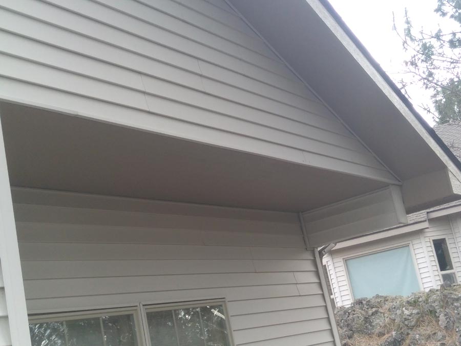 Close view of painted house siding and trim