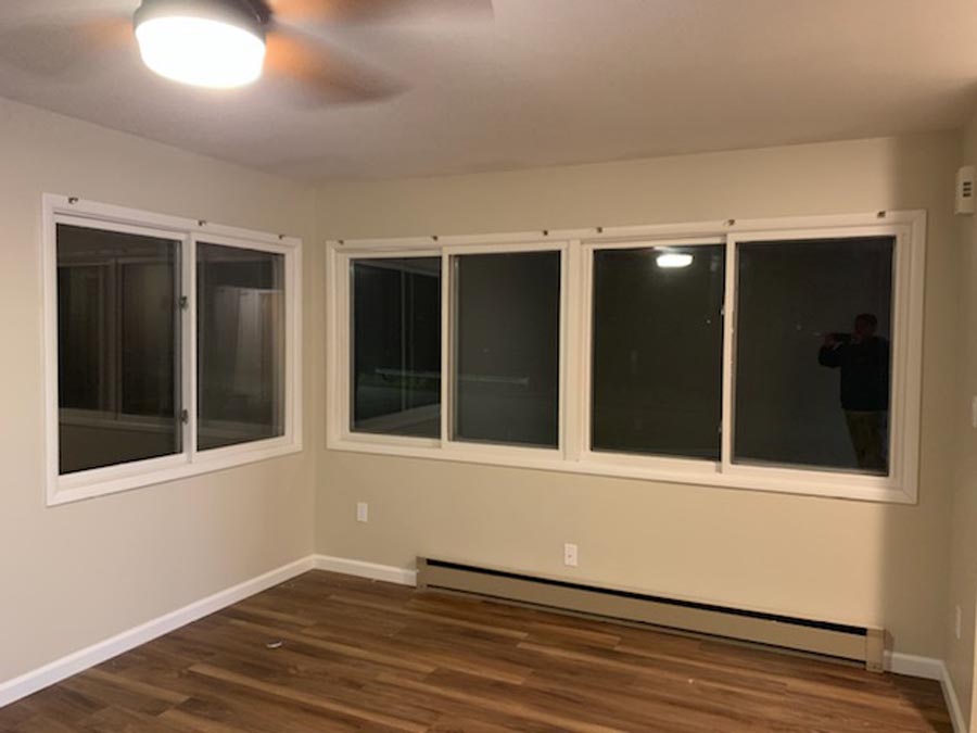 Painted room with windows at night