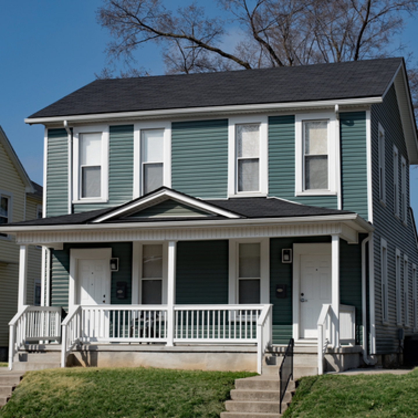 Two-story house with painted vinyl siding